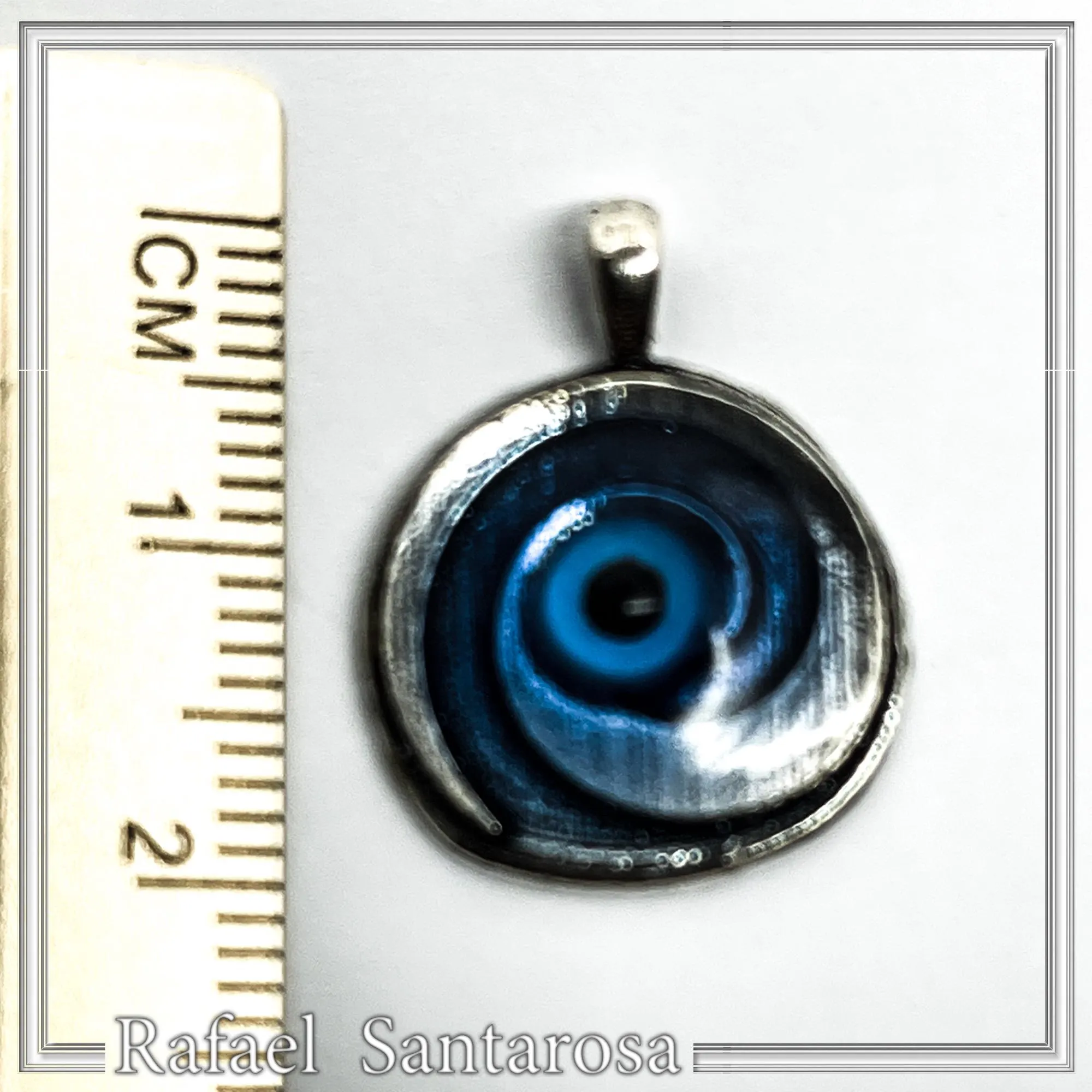Evil Eye Spiral Talisman Necklace: Sky Blue Transparent Enamel on Oxidised Sterling Silver — additional product image 6 from Rafael Santarosa Fine Jewelry