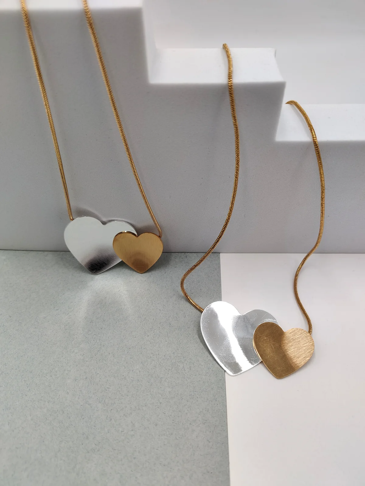 Stainless Steel Necklace with Two-Tone Hearts by Magis Handmade Jewels – view 2