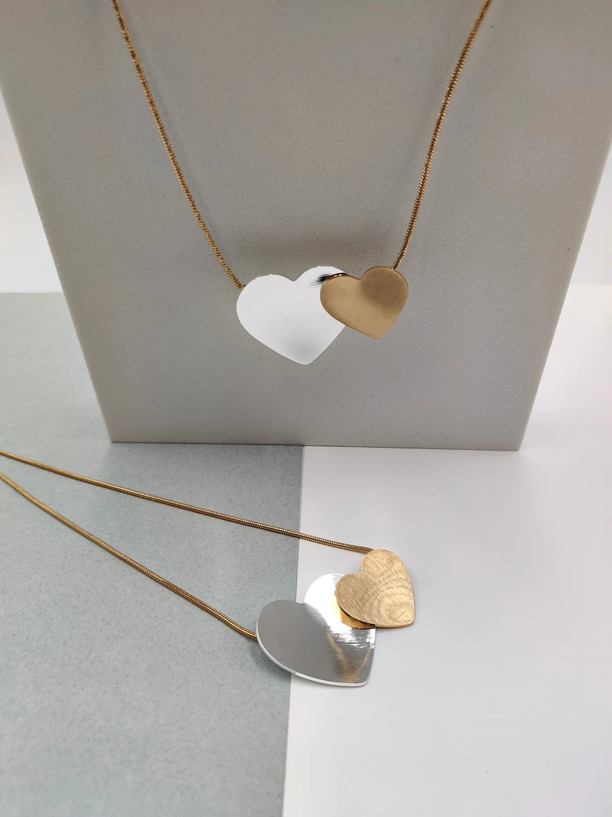 Stainless Steel Necklace with Two-Tone Hearts by Magis Handmade Jewels – view 3