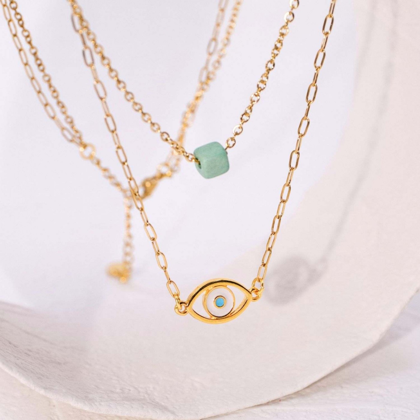 Gold-plated layered necklace with evil eye